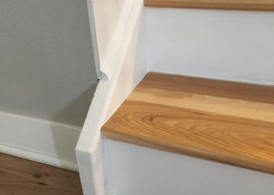 Repaired and painted trim on staircase