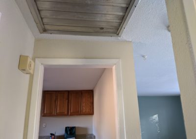 7. Ceiling fan vent and patched crack in drywall above kitchen doorway