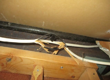 If we can see scary things like this unsafe, DIY electrical work (Spliced wired must be inside a covered junction box.), what kind of hazards are hiding in the paneled basement walls?
