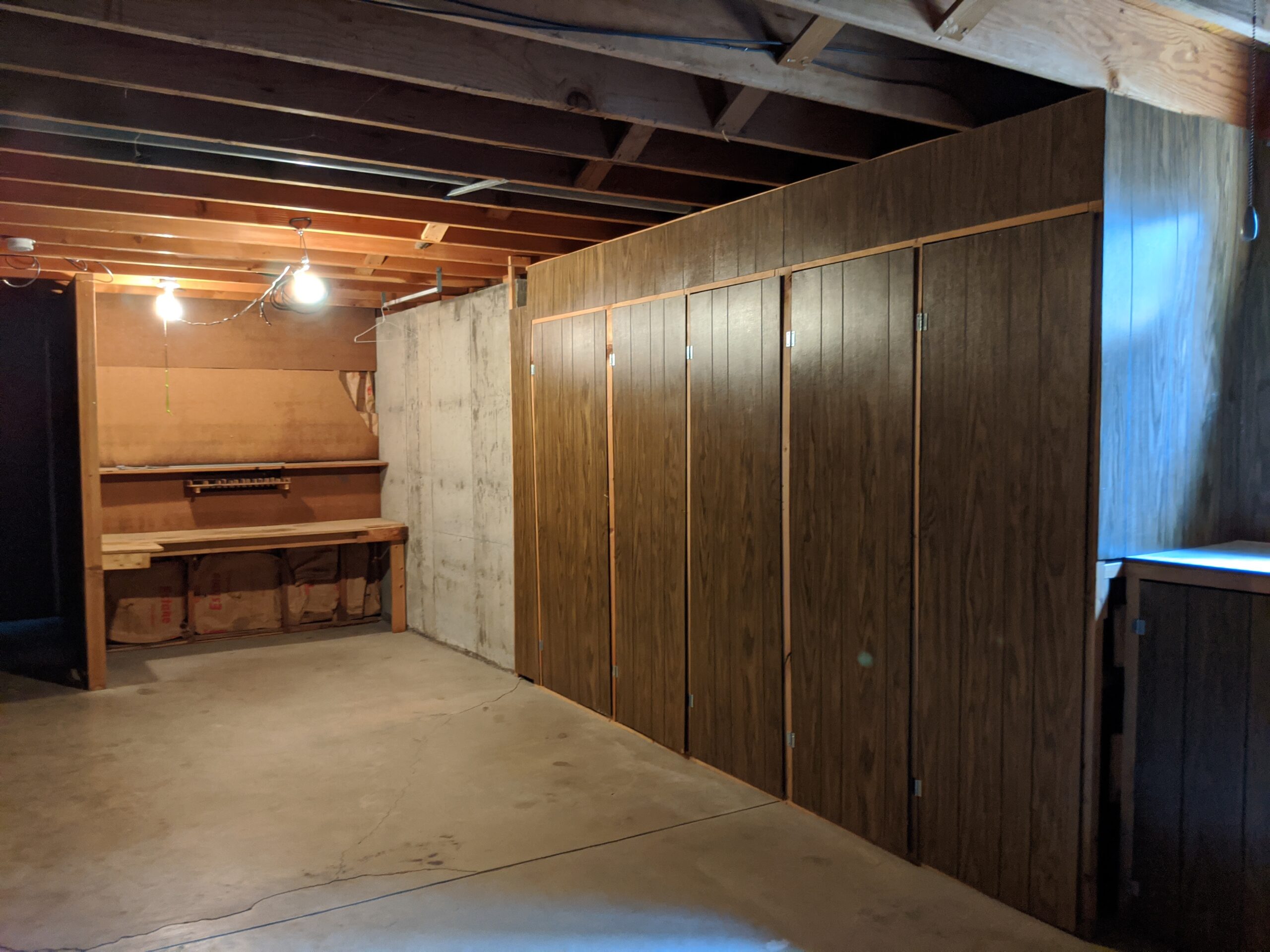 The previous owners built these functional cabinets and workbench but we removed them on our second day. We plan to gut this basement to the foundation walls, so we can rebuild it as a cozy living space.