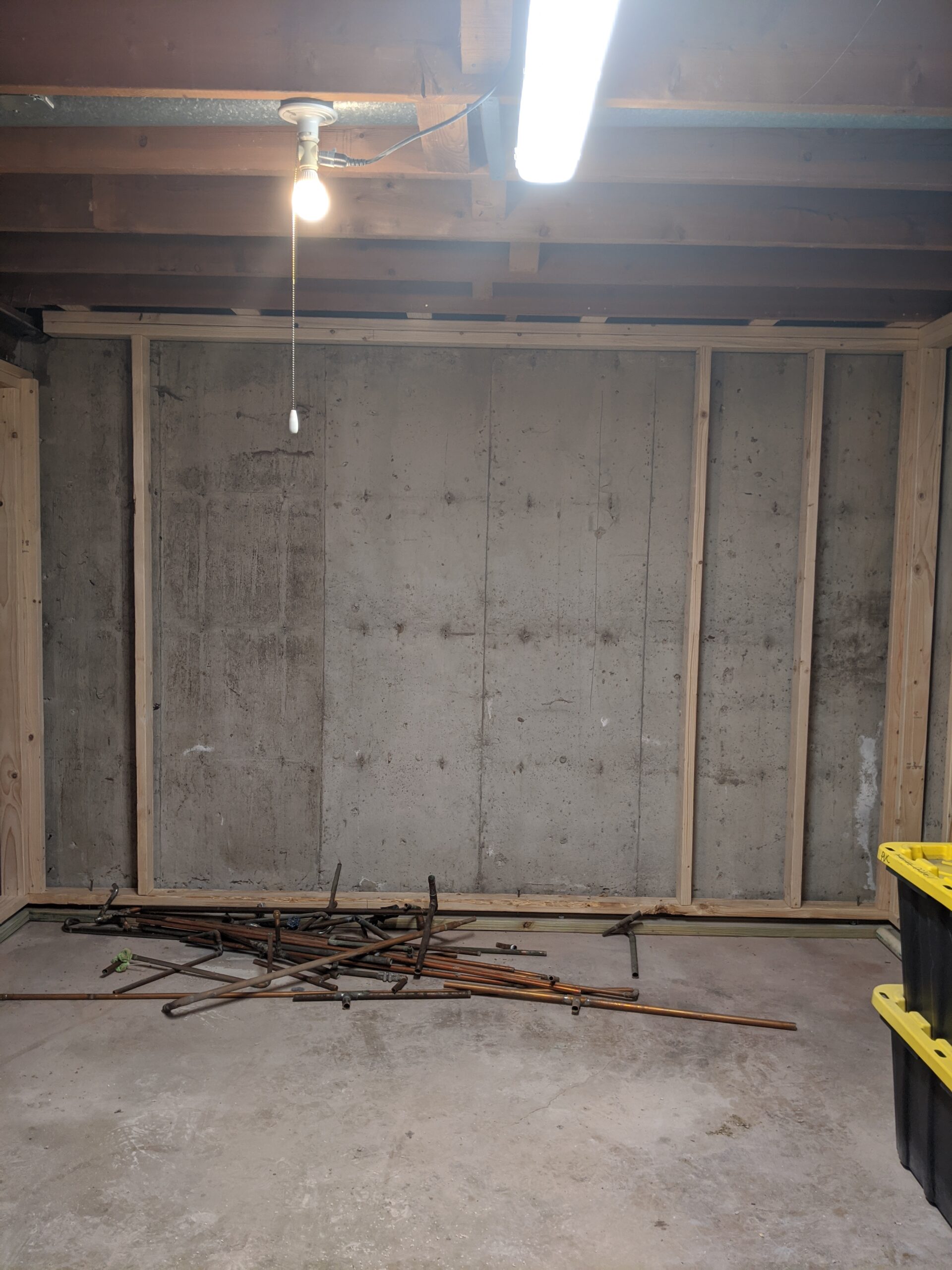 BEFORE: There was no existing window in the wall where we wanted to add the second basement bedroom, so we had to “force” one in this blank wall.