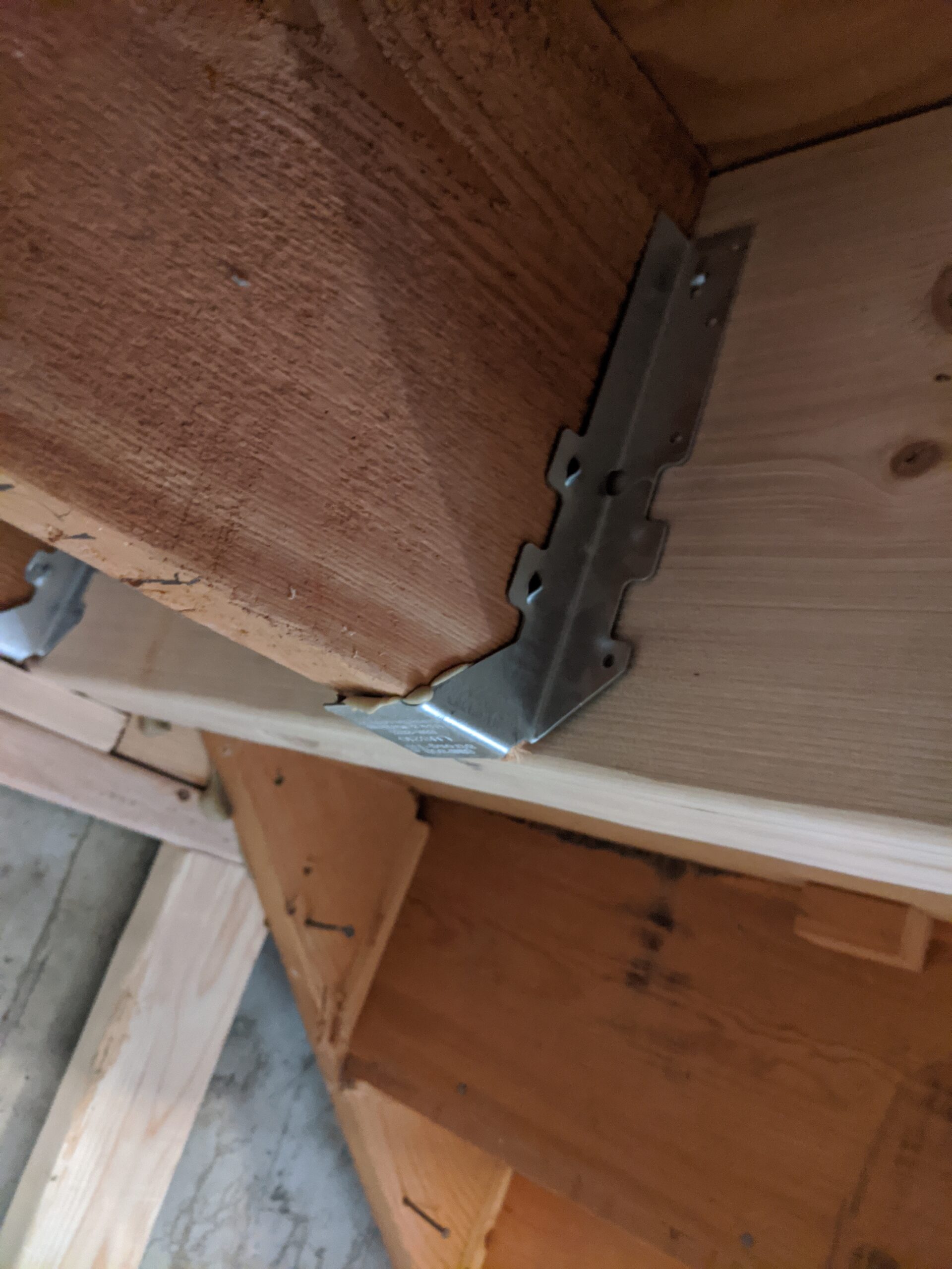 The engineer’s structural plans detailed where to attach specialized hardware, like these hangers to secure the stairs to the perpendicular floor joists.