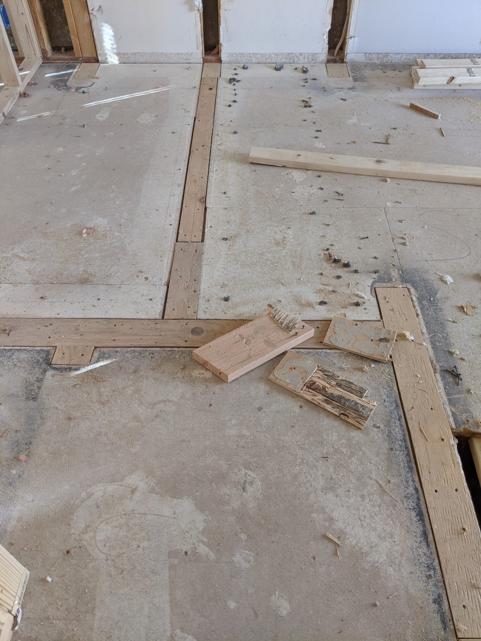 We removed the closet walls to combine 2 bedrooms, leaving voids in the subfloor. When installing floating floors, you can simply fill in these gaps with 2”x4” boards. If we picked flooring that attaches directly to the subfloor, we would have to replace the entire subfloor with new lumber to make it completely level—a major cost!