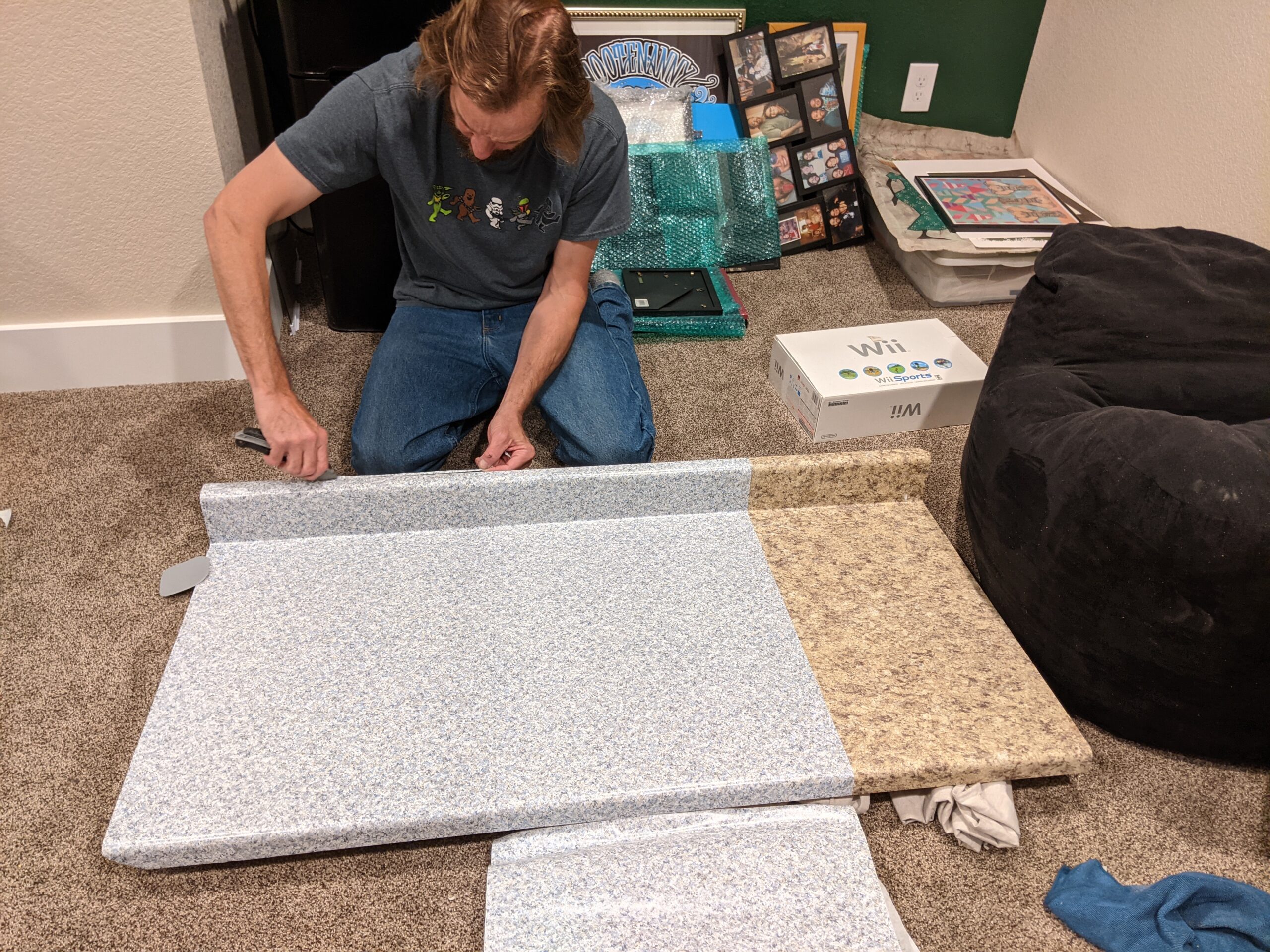IN PROGRESS We covered this countertop with contact paper to match the new combination bathroom/laundry room in the basement.
