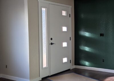 AFTER The windows in this front door let the light in while the obscured glass protects the homeowners' privacy.