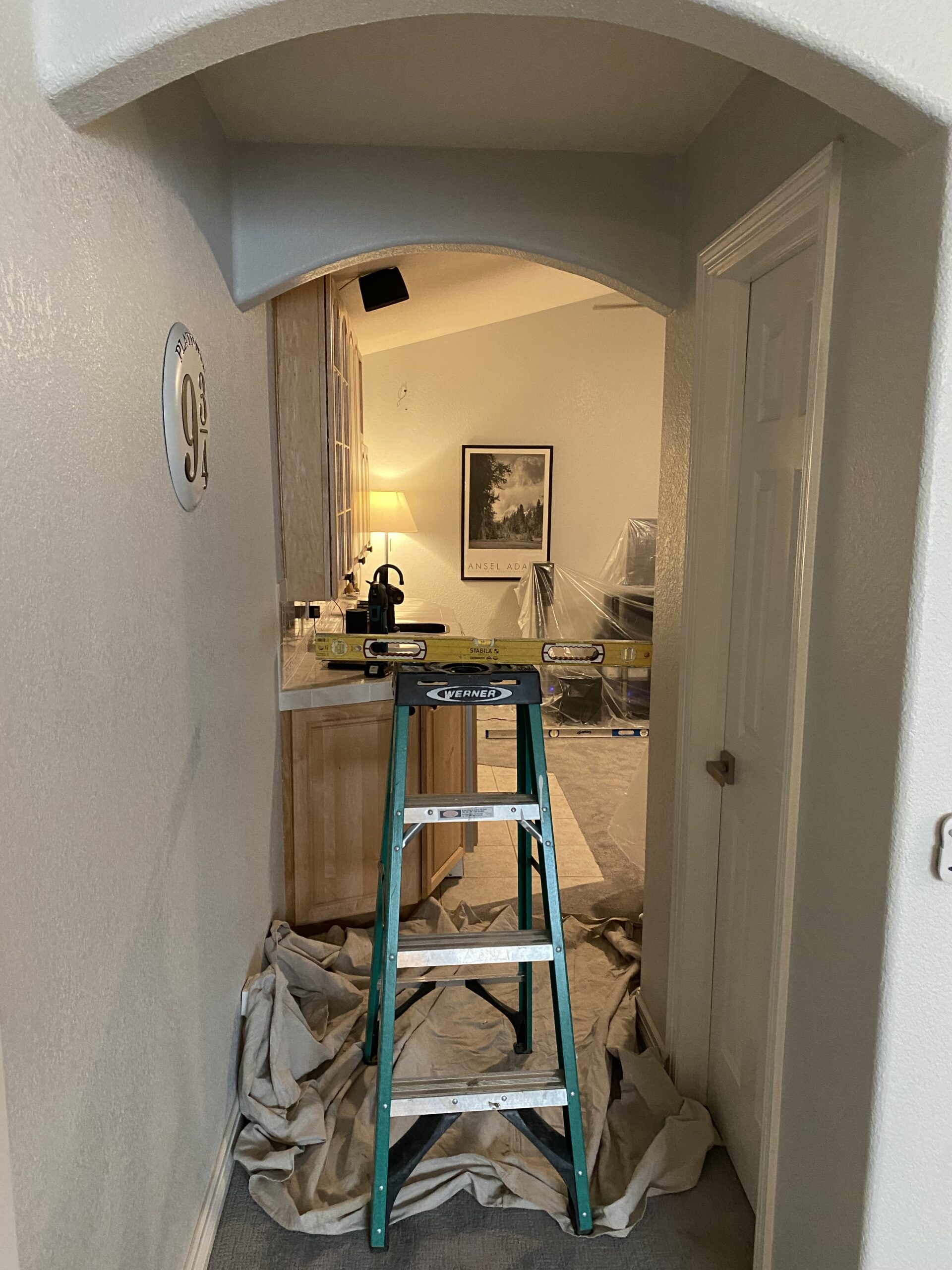 DURING Josh framed in this arched doorway to add a door where there wasn't one.