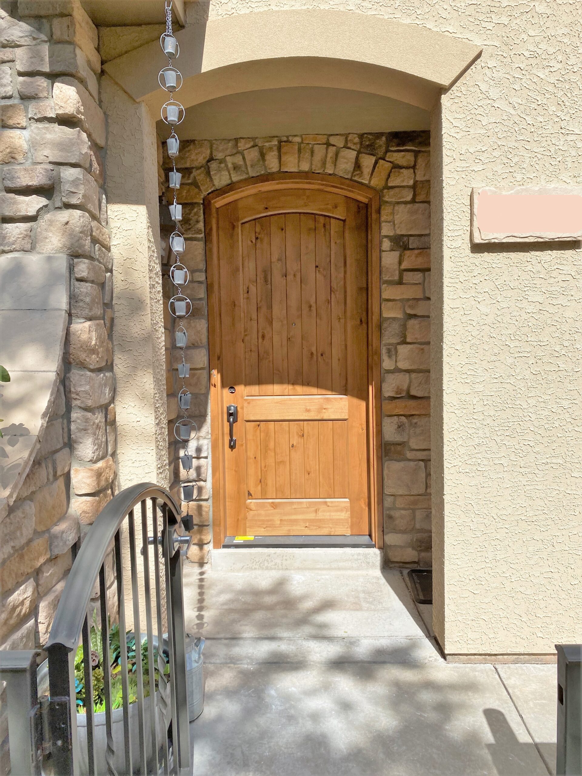 AFTER Josh replaced this arched entry door and the matching trim.