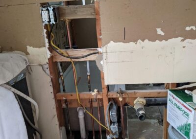 11. New plumbing in the wall of a home kitchen renovation to supply the kitchen and neighboring bathroom.
