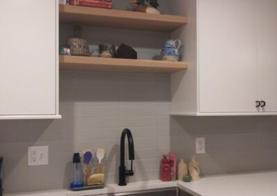 20. Open shelving detail in home kitchen remodel blend style and function.