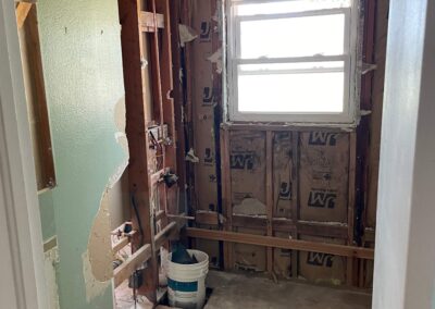 23. Demoed home bathroom during home renovation, tub removed, toilet removed, and vanity and sink removed