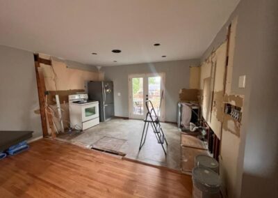 During home kitchen renovation demolition, cabinetry & pony wall removed