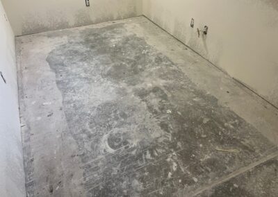 Floor and wall prep in flood damaged basement