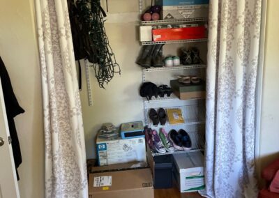 Closet in home with curtains instead of doors