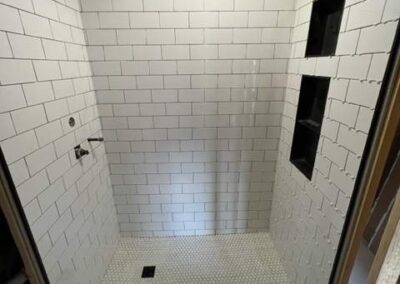 New white subway tile in basement bathroom remodel