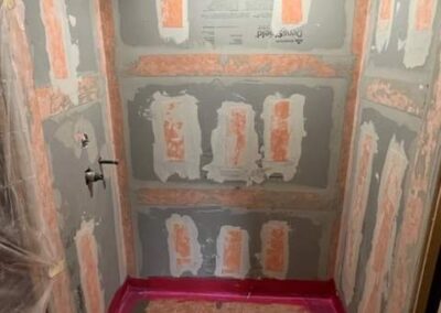 During a basement bathroom remodel new subflooring and drywall are installed