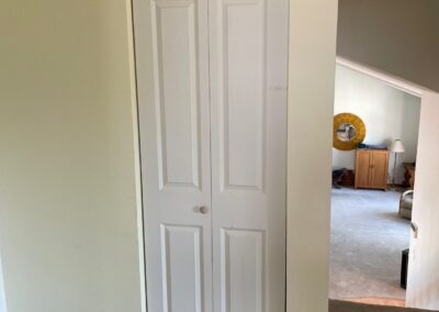 Functional option without breaking the bank! While we replaced the prehung (swinging) interior doors with solid core, Shaker-style doors, this bifold linen closet door would have been the most expensive door in the house. Instead, we saved the homeowner $1,170 by picking a slightly different 2-panel style that still matches the rest of the new doors.