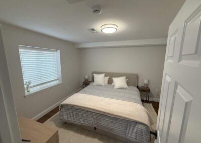 Basement bedroom with closet space and modern finishes