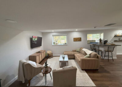 Basement living room with sectional sofa and bar seating
